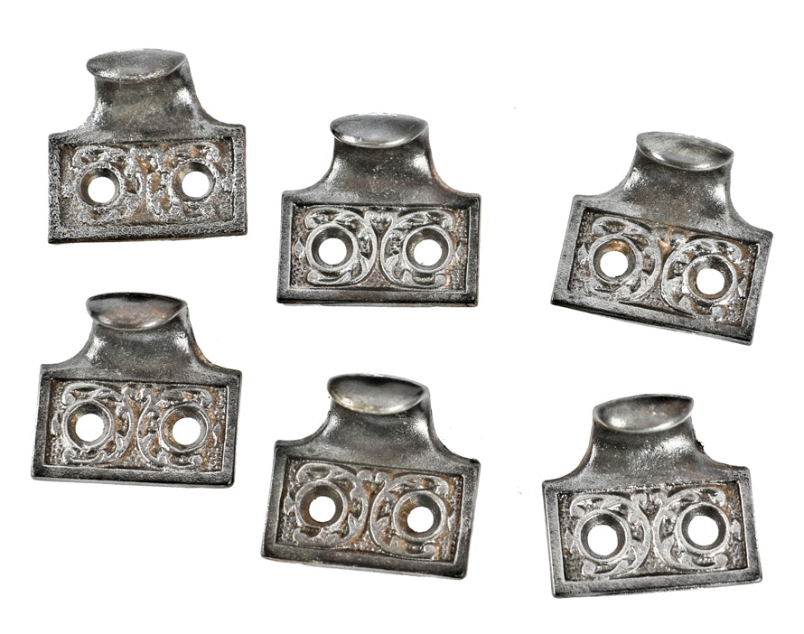 group of six matching late 19th century salvaged chicago ornamental cast iron dana hotel interior window sash lifts or finger pulls with brushed metal finish