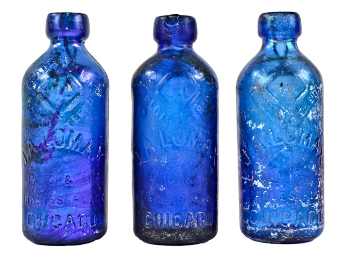 group of three original richly colored c. 1880's unearthed chicago john lomax cobalt blue soda or mineral water bottles with patented spring stoppers