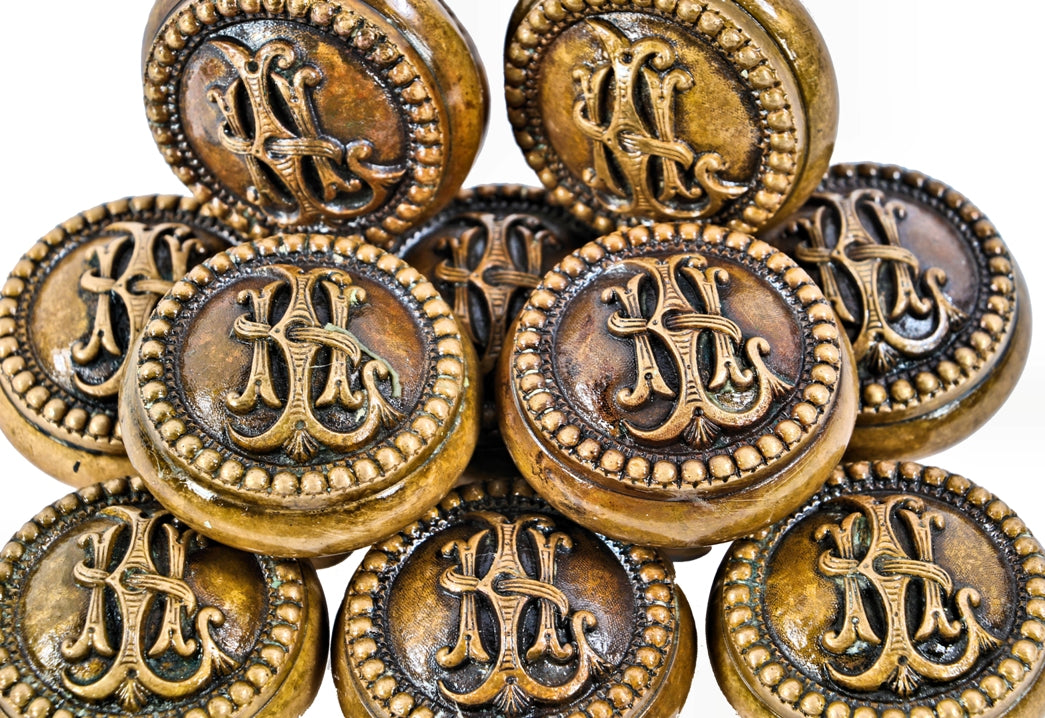 one of twelve matching 19th century original american ornamental cast bronze monogrammed lexington hotel guestroom doorknob with a nicely aged surface patina