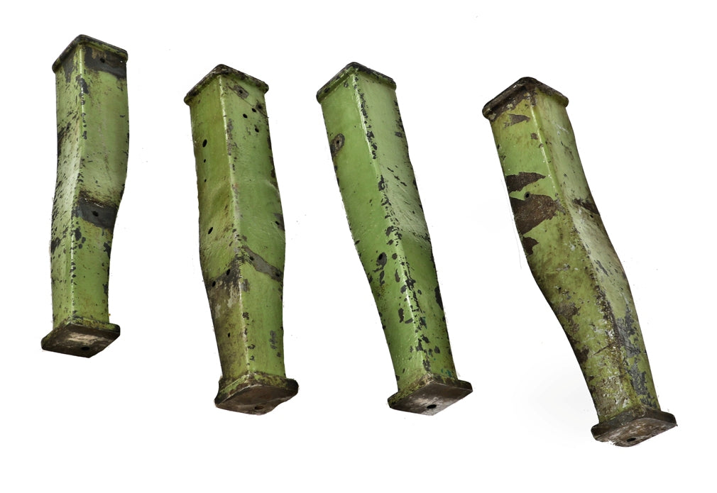 four matching highly sought after early 20th century antique american industrial "factory green" painted curvaceous typesetting machine legs or bases