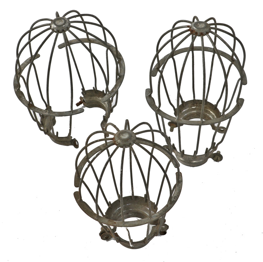 three original and weathered early 20th century antique american industrial "loxon" galvanized steel factory pendant light bulb guard or cage