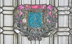 unusual c. 1910-195 salvaged chicago oversized leaded art glass residential window featuring a centrally located variegated shield and laurel wreath