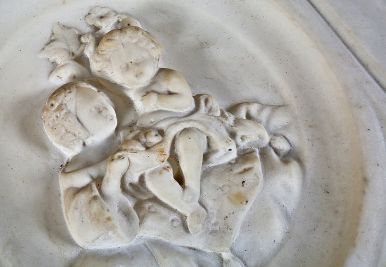rare 1850's early american salvaged chicago carved alabama marble residential fireplace mantel with encircled bas-relief cherubs flanking oversized keystone