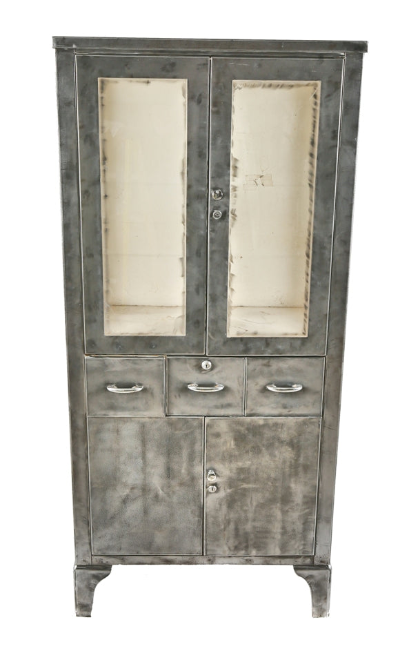 highly desirable oversized cold-rolled steel freestanding salvaged chicago antique american medical cabinet with two hinged cabinet doors, drawers, and glass sidelights
