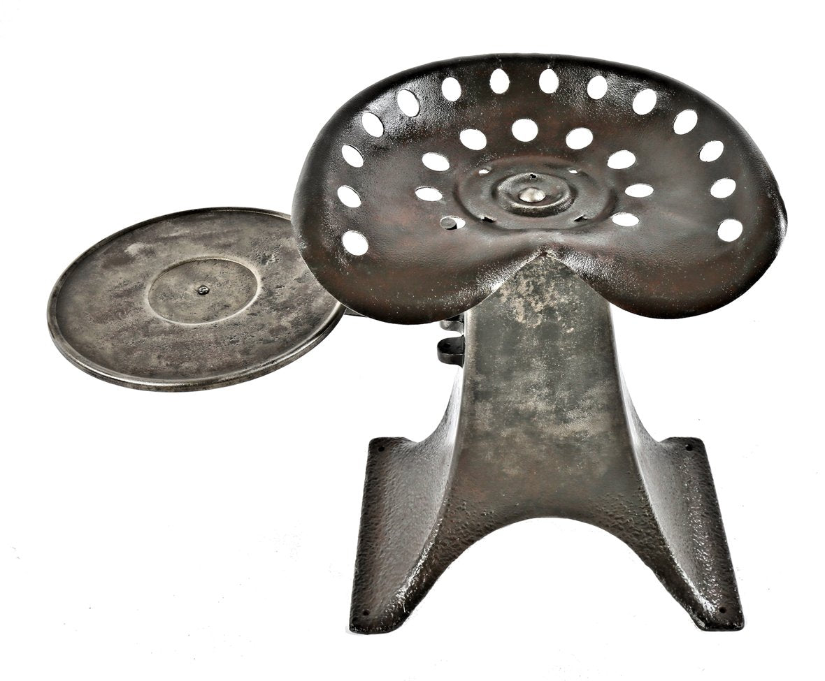repurposed heavy duty vintage american industrial stationary low-lying cast iron chair or stand with integrated swing-out tray and tractor seat