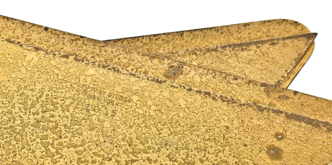 four matching early 20th century gold-plated cast bronze tiffany desk blotter corners from the office of chicago architect william bryce mundie