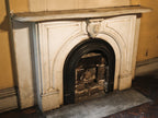 original early 1870's salvaged chicago interior residential white carrara marble fireplace mantel with arch top opening and ornamental keystone
