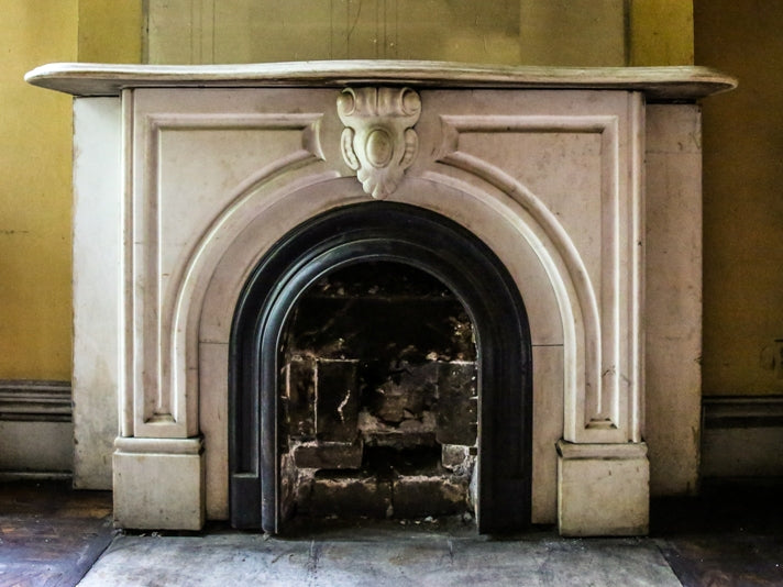 original early 1870's salvaged chicago interior residential white carrara marble fireplace mantel with arch top opening and ornamental keystone