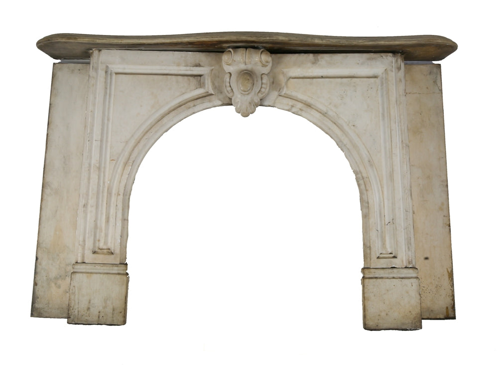 original early 1870's salvaged chicago interior residential white carrara marble fireplace mantel with arch top opening and ornamental keystone
