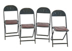 group of four matching heavily reinforced pressed and folded black enameled chicago stadium industrial folding chairs with original seat pads