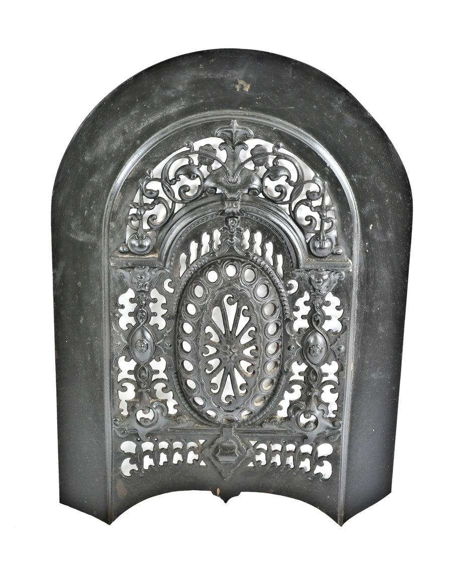 early 1870's ornamental cast iron salvaged chicago arch top interior residential fireplace perforated summer cover with a mostly uniform black enameled finish