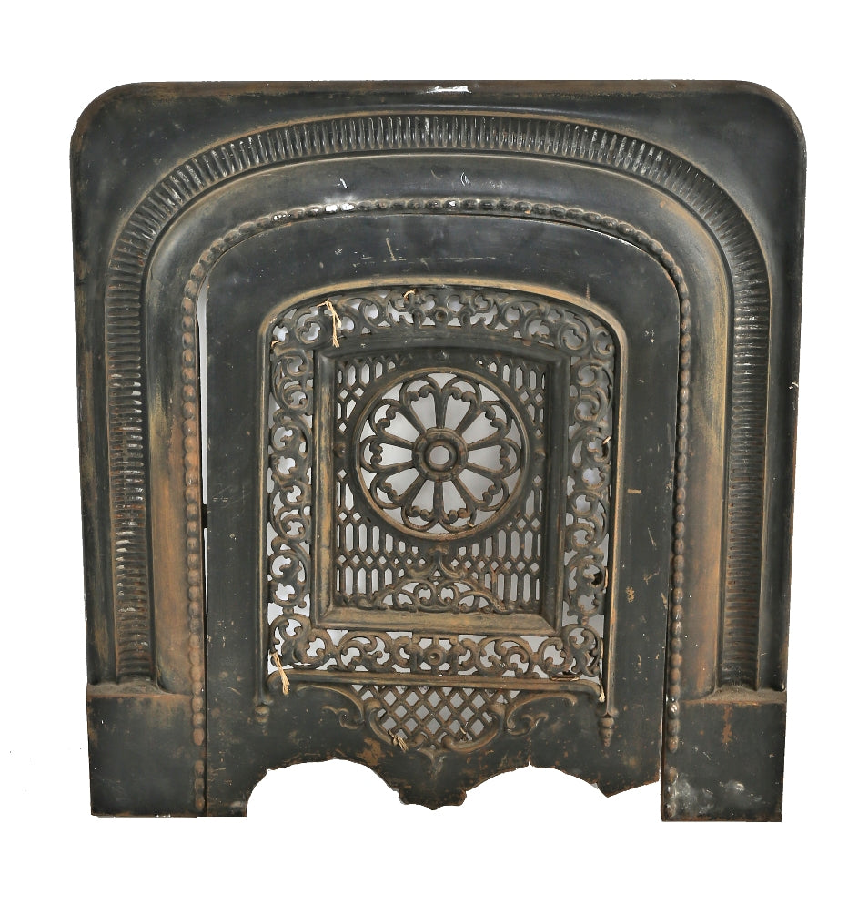 single 19th century ornamental cast iron salvaged chicago interior residential fireplace surround and matching summer cover with a mostly uniform black enameled finish