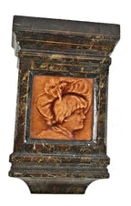 original and intact salvaged chicago cast iron fireplace mantel keystone with centrally located figural majolica tile