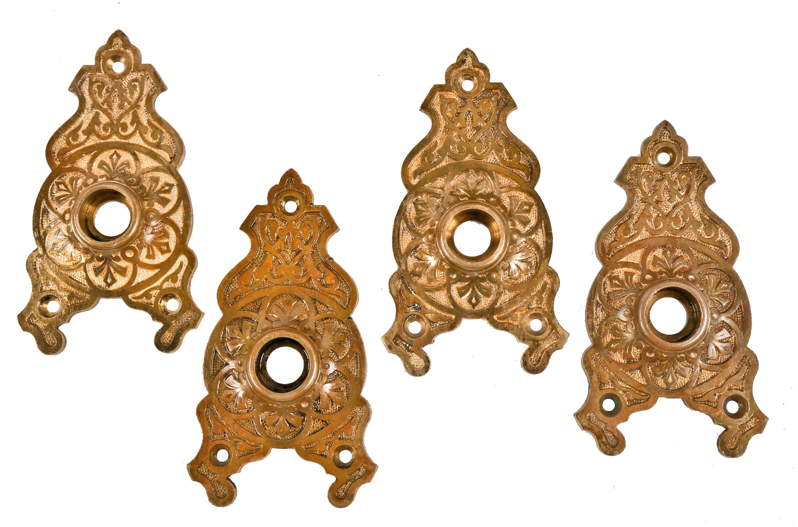 four matching oversized c. 1870's ornamental cast bronze interior residential american victorian doorknob backplates or escutcheons with mostly uniform patina