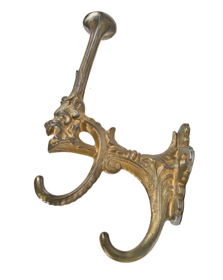 late 19th century american victorian era cast iron grotesque profile oversized wall or surface-mount residential coat or garment hook with nicely weathered gold finish