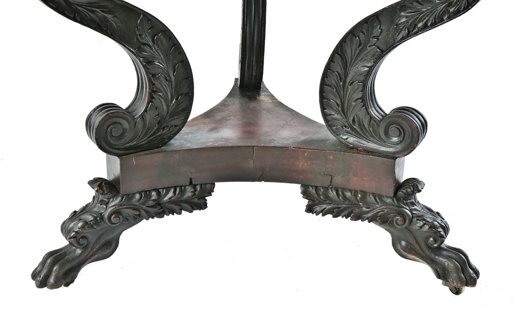 heavily carved three-legged 19th or early 20th century antique american solid walnut wood table with original darkly stained finish and intricately detailed clawfeet