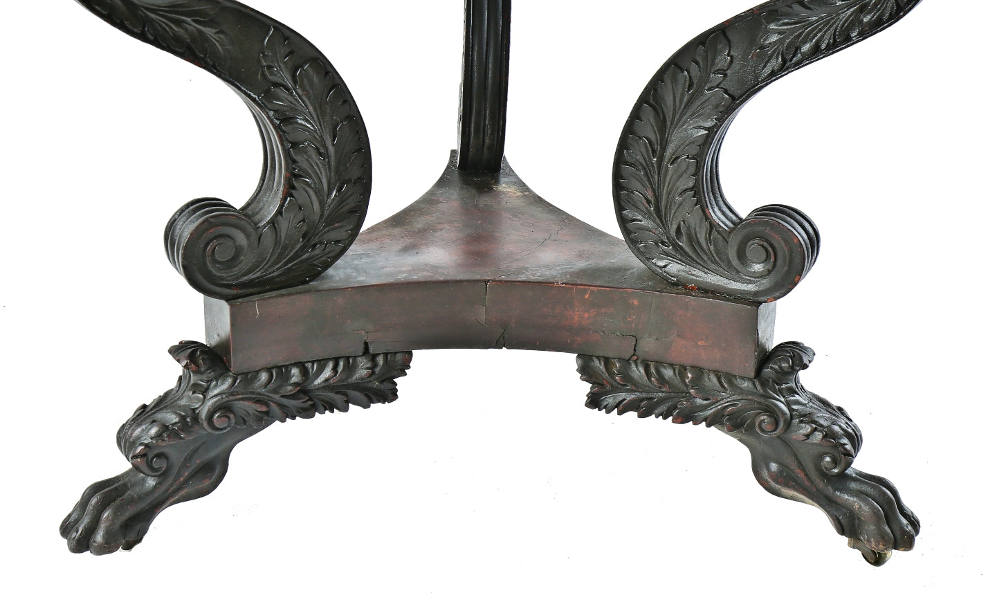 heavily carved three-legged 19th or early 20th century antique american solid walnut wood table with original darkly stained finish and intricately detailed clawfeet