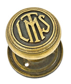 group of four matching interior logan square masonic temple building monogrammed cast brass doorknobs with nicely aged surface patina