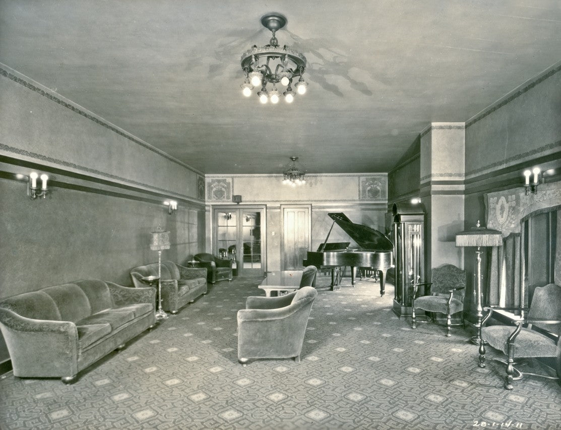 one of several original early 20th century logan square interior hanging wrought iron lights with barebulb cluster sockets