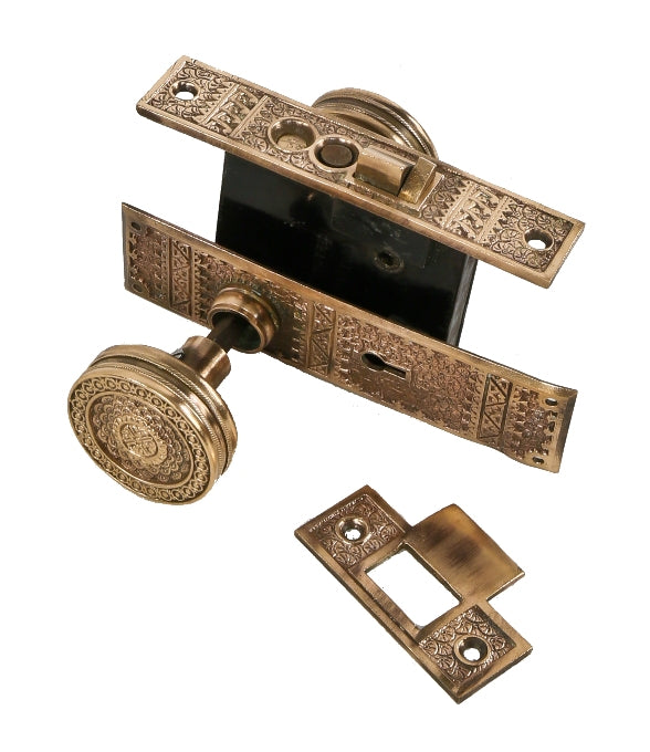 original late 19th century ornamental cast bronze "brocade" pattern exterior residential entrance door lockset with hard to find strike plate