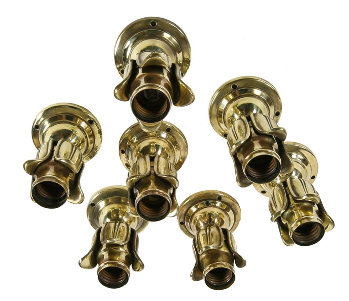 group of seven hard to find early 20th century ornamental cast brass residential flushmount barebulb lights with concealed keyless sockets