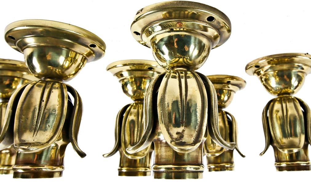 group of seven hard to find early 20th century ornamental cast brass residential flushmount barebulb lights with concealed keyless sockets