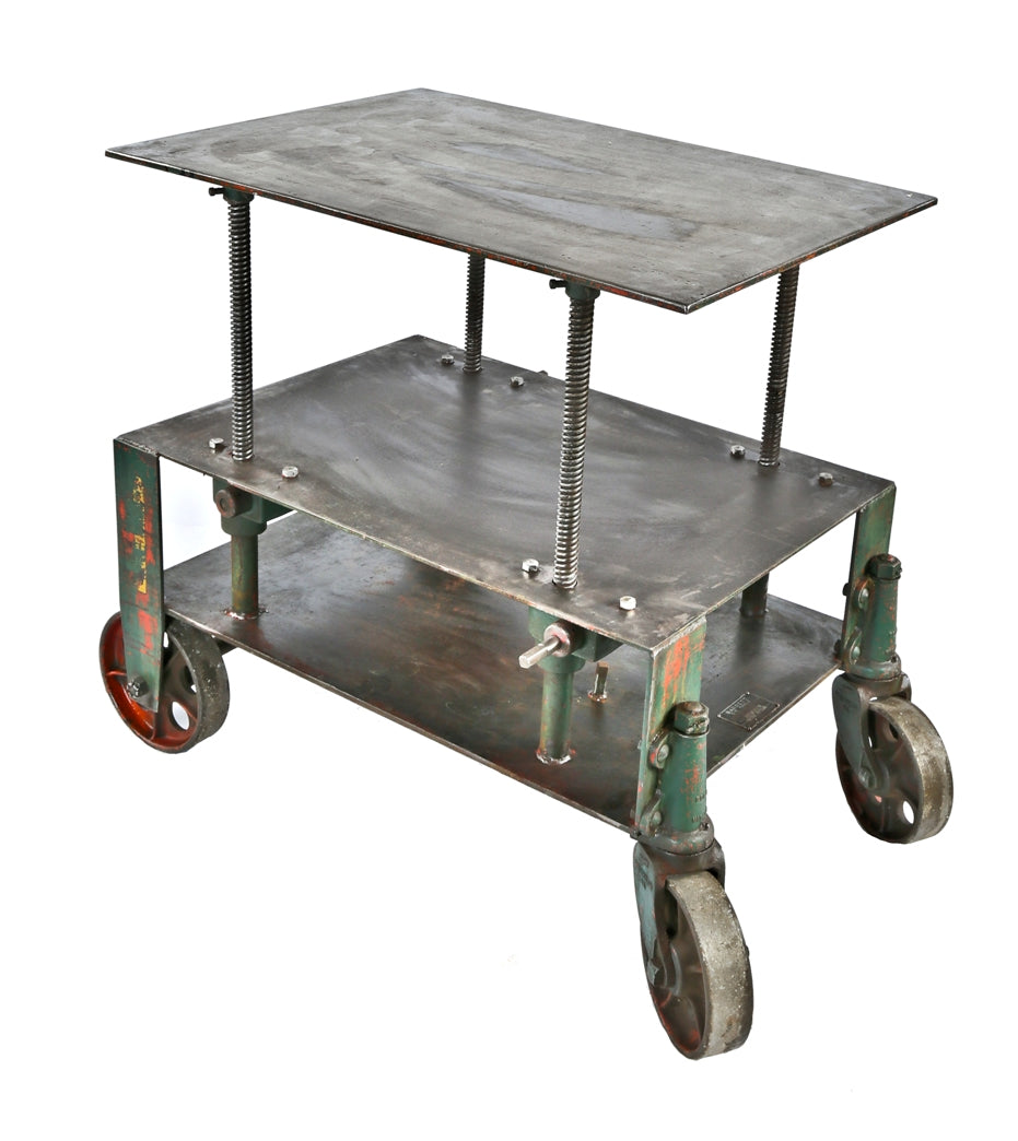 fully functional all original c. 1930's american industrial adjustable height "barrett" die table  with original spoked cast iron wheels