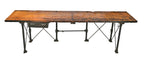 lightly refinished oversized 1930's depression era zim factory machine shop table or workbench with nicely weathered wood top and tubular cast iron bases