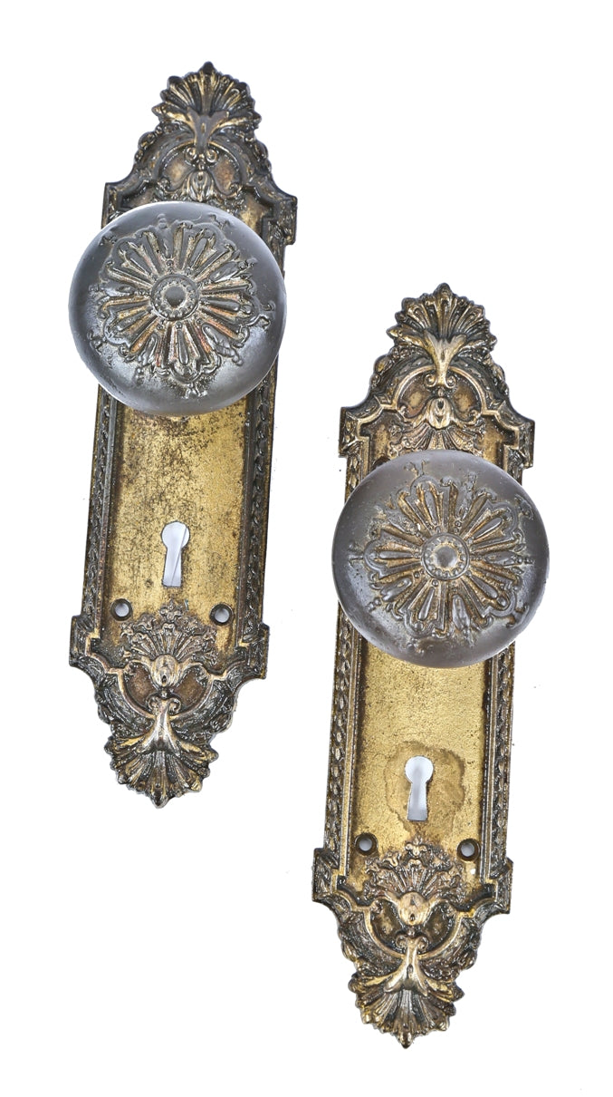 lightly cleaned original antique american ornamental cast iron "ontario" pattern salvaged chicago entrance door knobs and matching oversized backplates or escutcheons