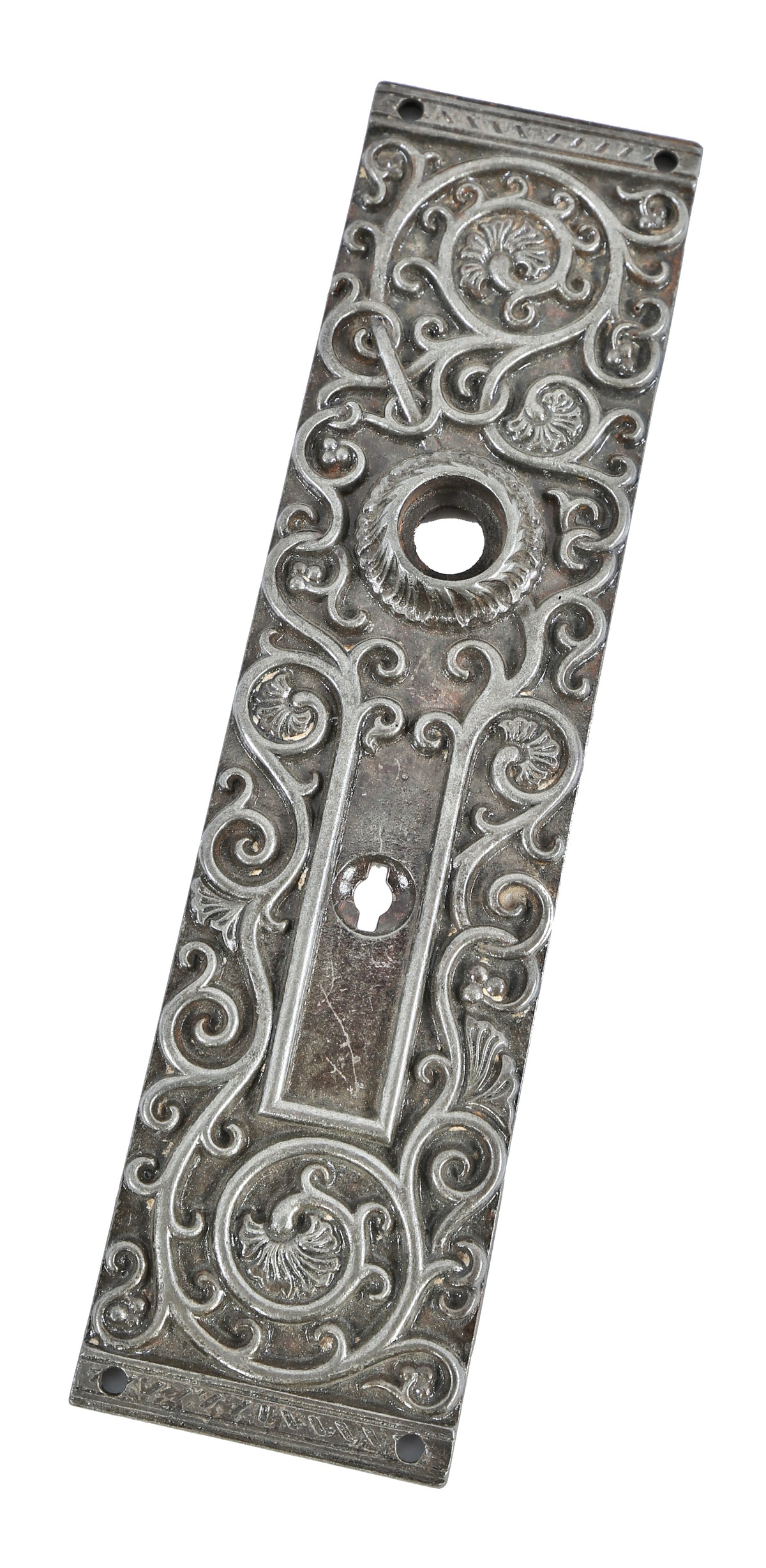 late 19th century american ornamental cast iron residential doorknob backplate with distinctive deeply embossed foliated scrollwork