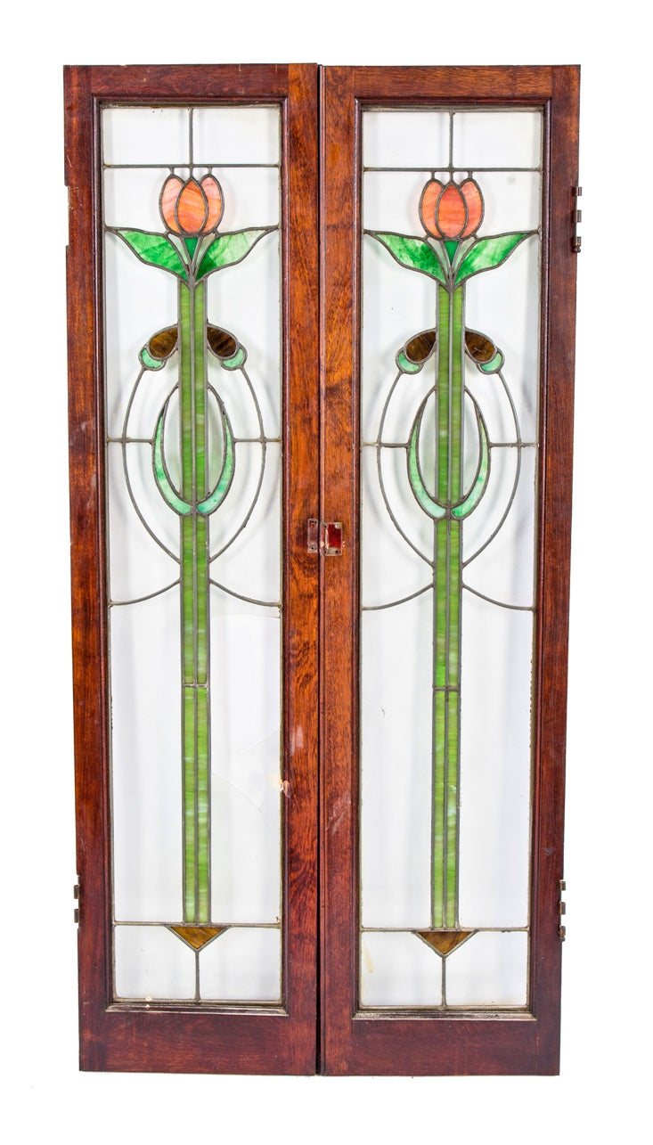 set of original early 20th century american art glass interior residential cabinet door windows featuring richly colored stained glass floral motifs