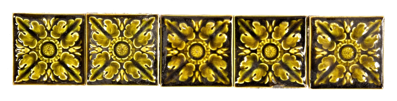 group of five original and intact c. 1880's salvaged chicago olive green majolica glazed interior residential fireplace tiles with embossed flowers