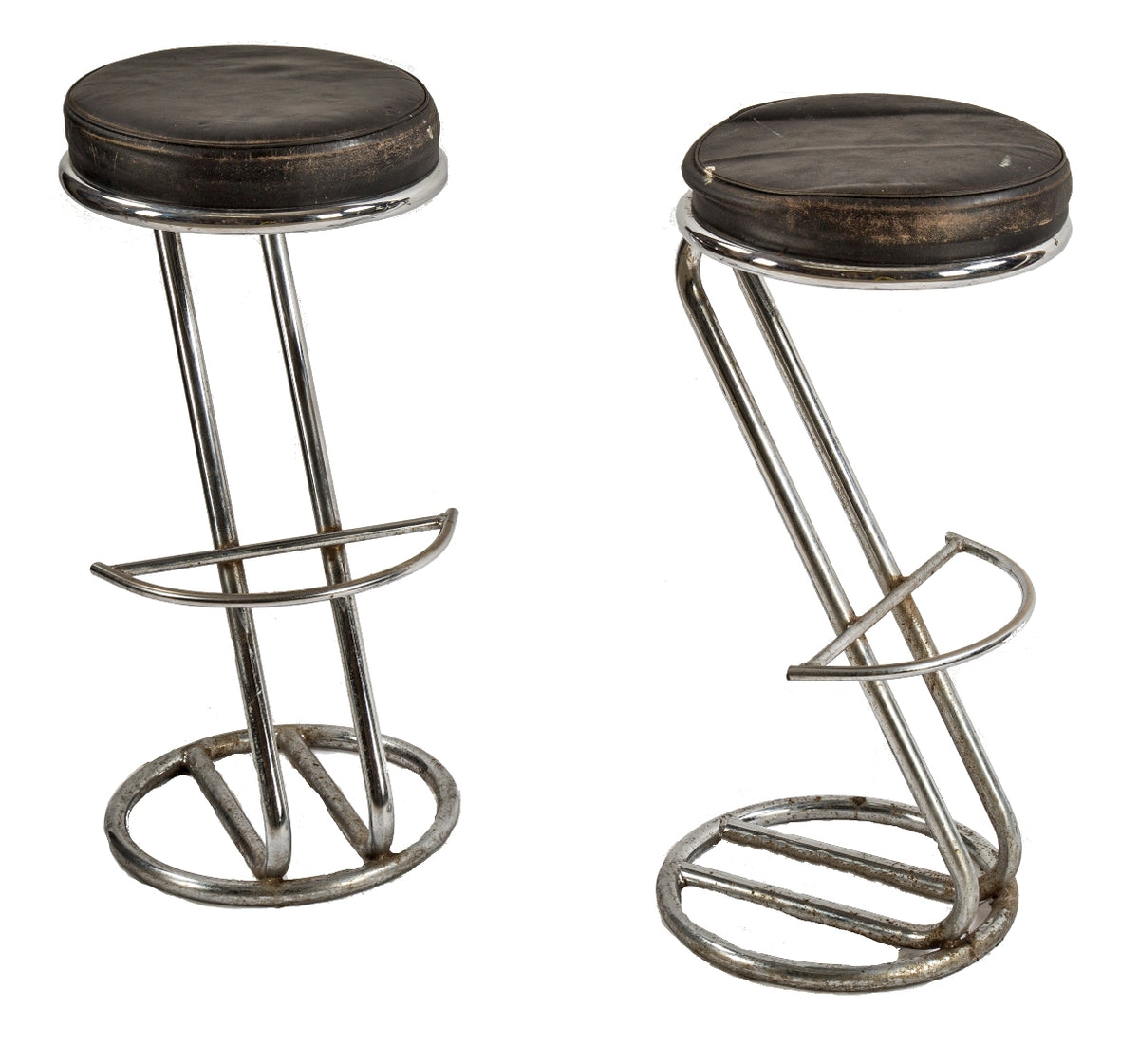 two matching american art deco style vintage polished chrome tubular steel stools designed in the manner of gilbert rohde with curvaceous  footrests