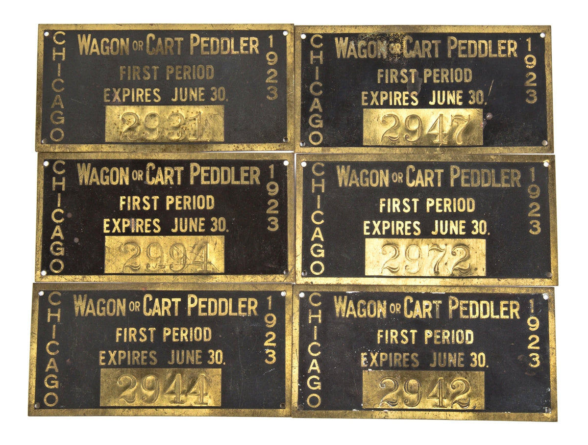 group of six baked black enameled and yellow copper single-sided c. 1920's original stamped city of chicago street peddler licenses with prominently displayed expiration dates