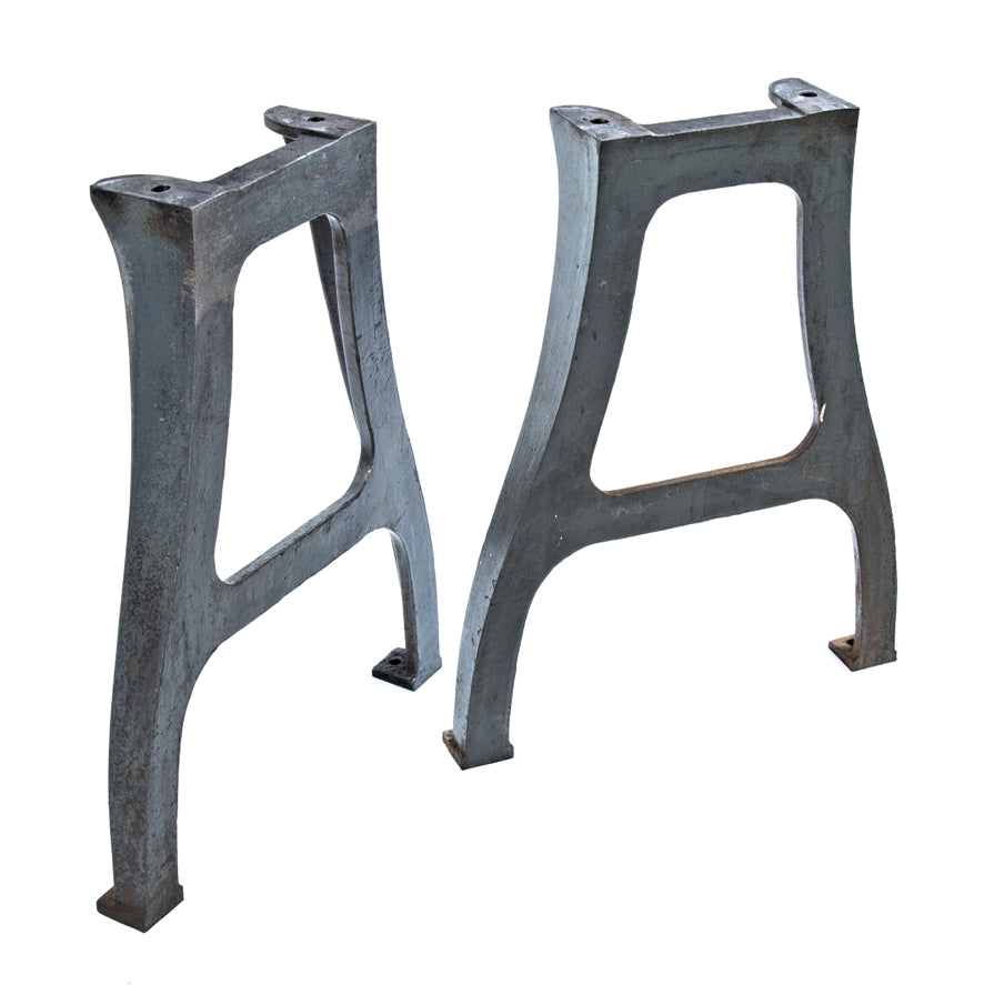 two matching antique american industrial salvaged chicago machine shop cast iron curvaceous lathe bases for use with repurposed table