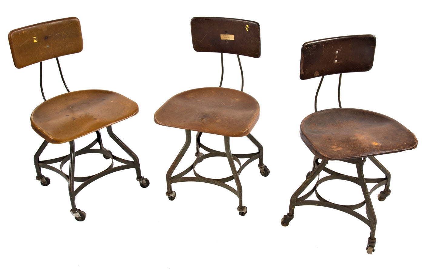 group of three original and intact c. 1940's salvaged chicago antique industrial "uhl art steel" swivel stools with spacious saddle seats and fully functional bassick casters