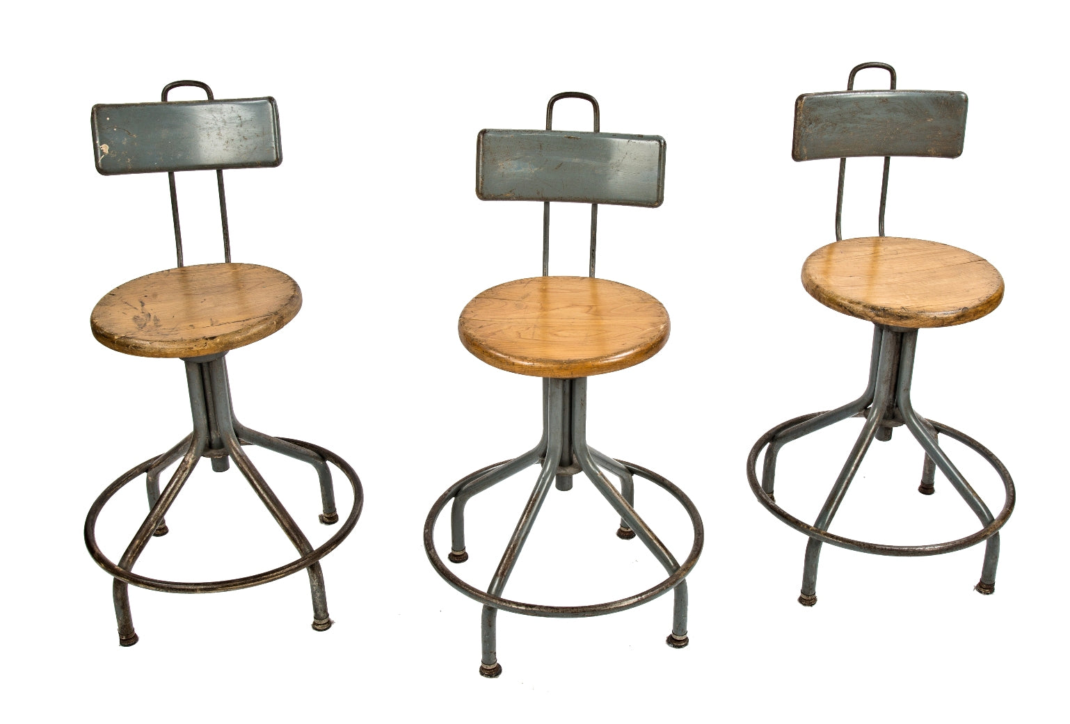 group of three fully adjustable all original salvaged chicago school laboratory stools with solid circular-shaped maple wood seats and welded joint heel rings