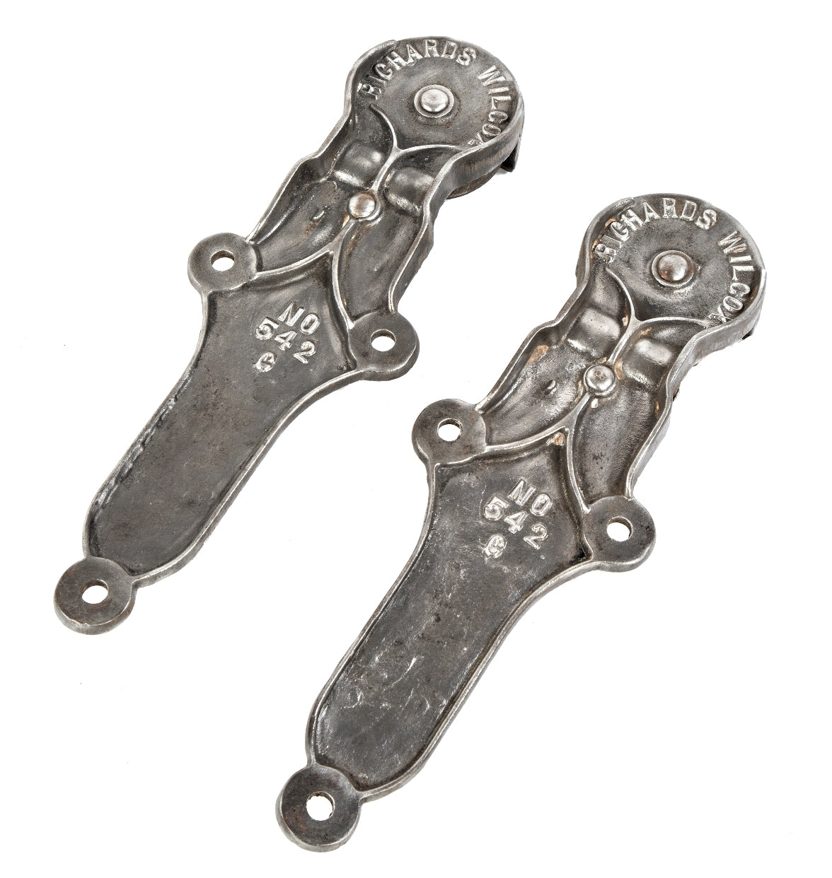 matching set of original and intact early 20th century antique american industrial salvaged chicago factory fire door hanger brackets comprised of cast iron with single sheaves