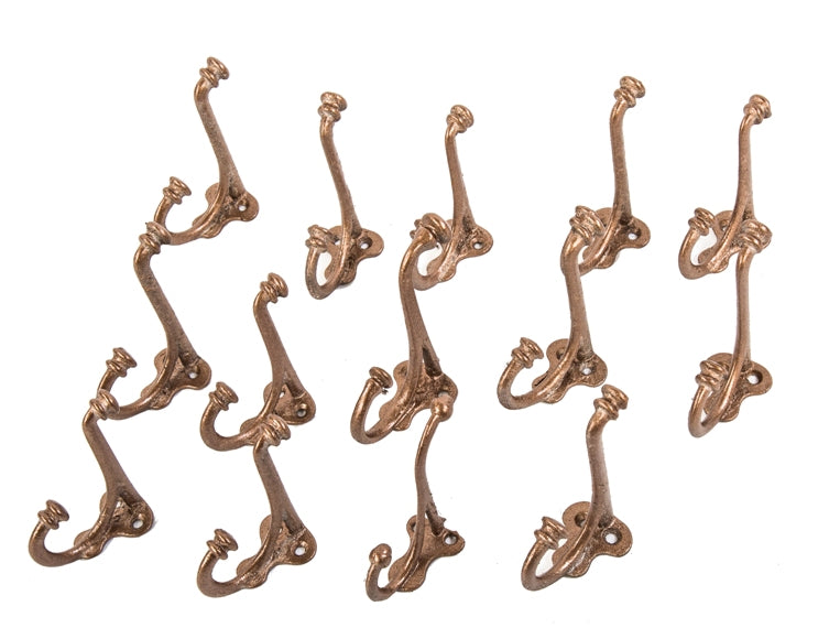 large lot of matching gold painted early 20th century cast iron interior residential hooks salvaged from a chicago residence undergoing demolition