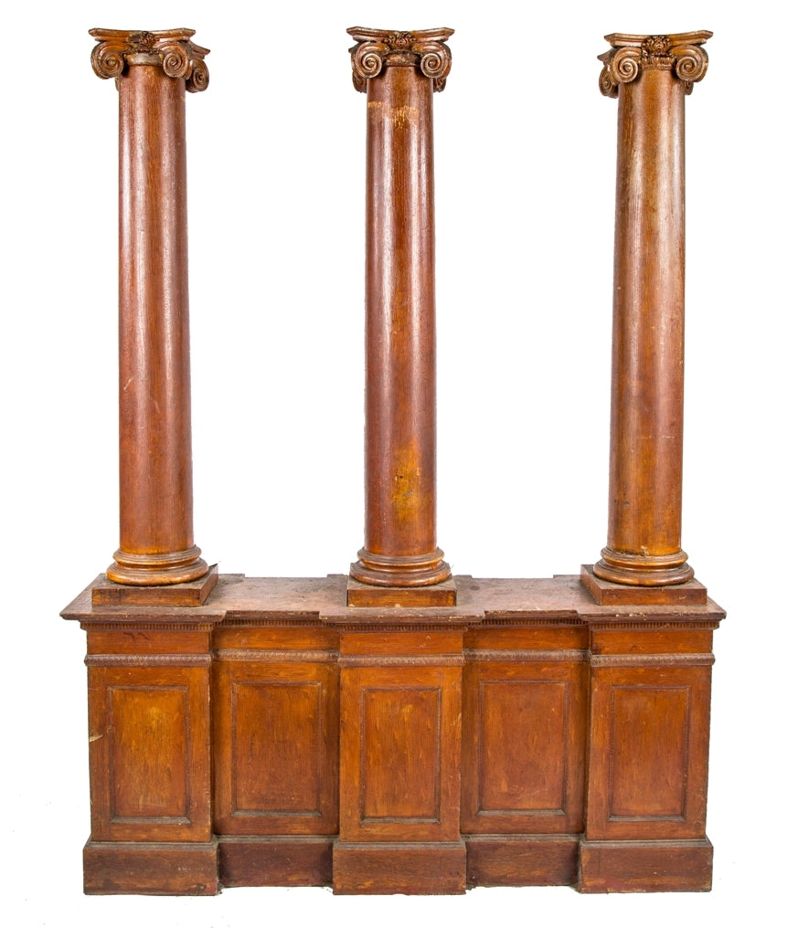 unusual early 20th century freestanding oversized interior residential american victorian era oak wood room divider with three matching tapered columns adorned with ionic capitals