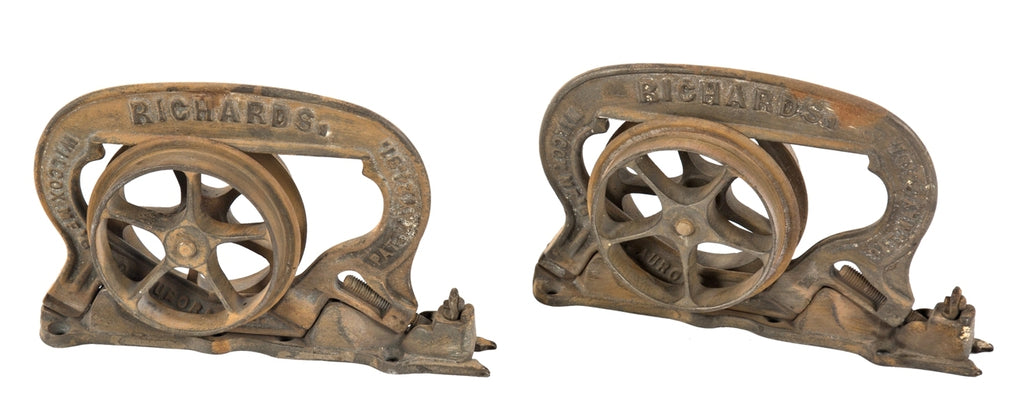 original and intact hard to find original interior residential ornamental cast iron single pocket door brackets or hangers with rollers and base plates