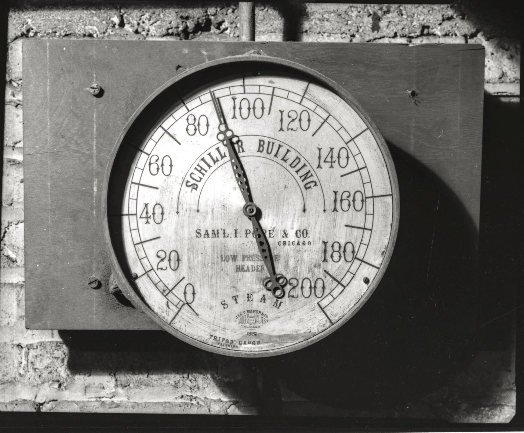 original oversized cast brass encased steam pressure gauge salvaged from holabird and roche's pontiac building abandoned basement heating plant dating to 1890