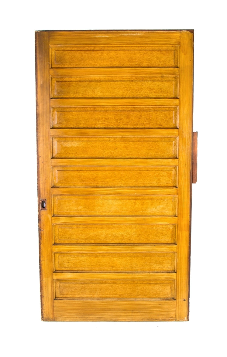 oversized late 19th century original salvaged chicago raised panel pine wood pocket door with hand-applied faux grain finish