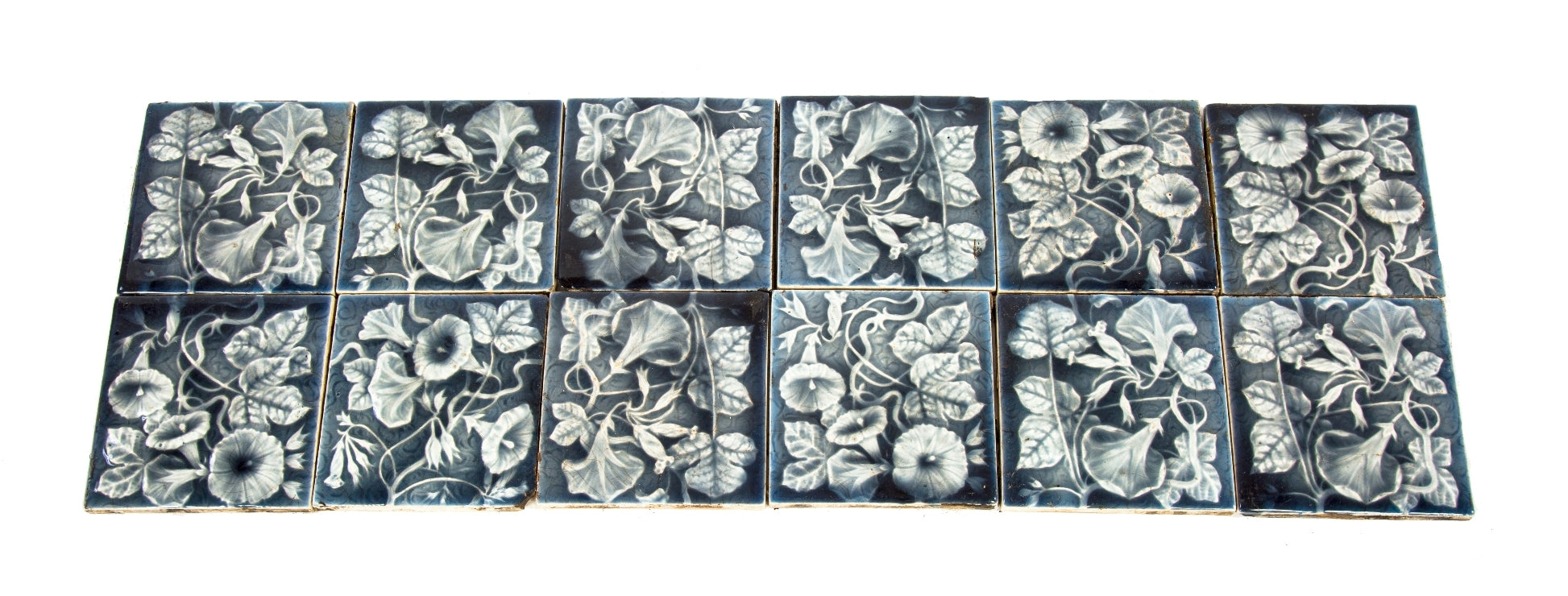 group of matching late 19th century salvaged chicago antique american glazed majolica residential fireplace tiles with elaborate floral motifs