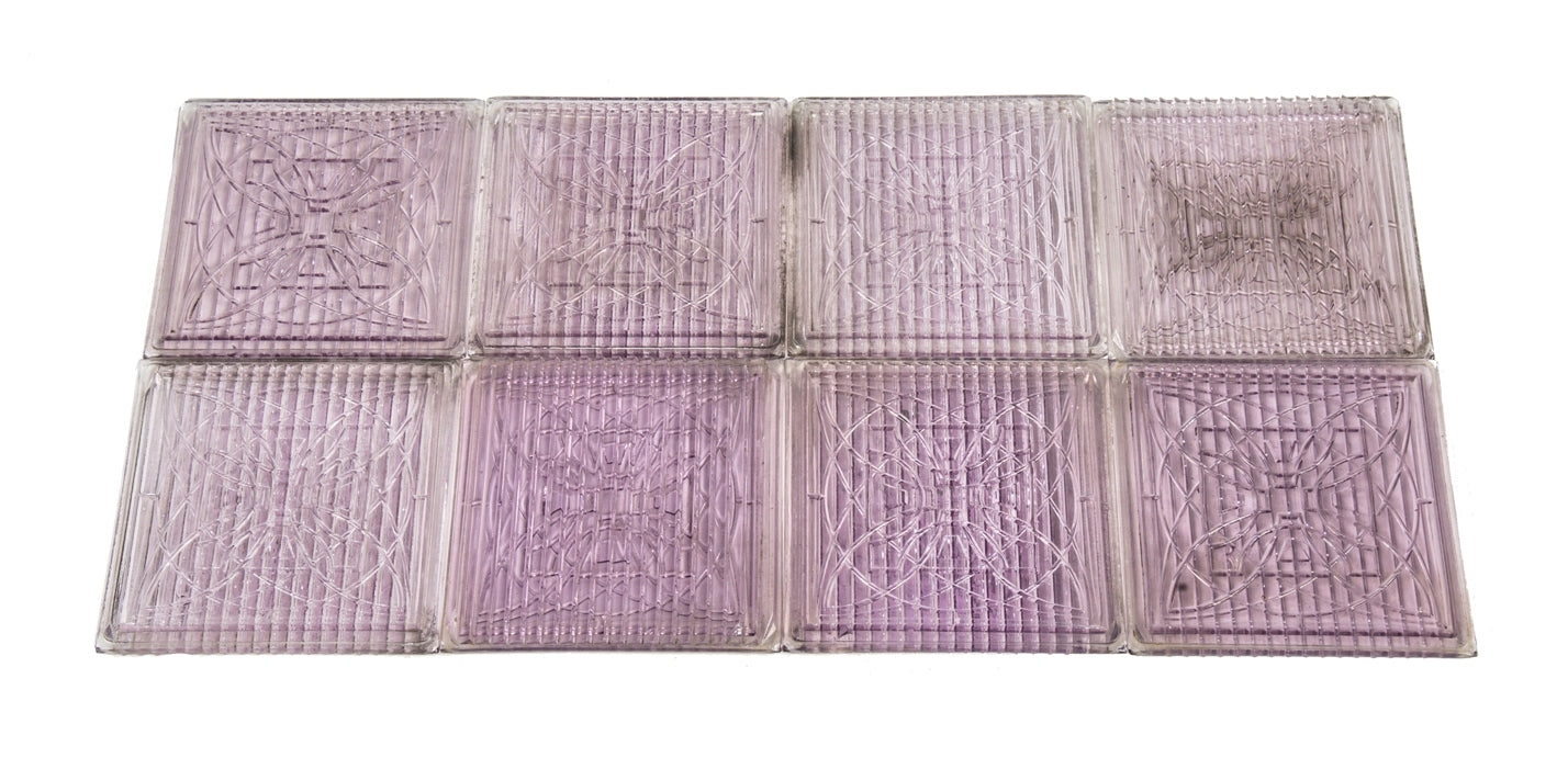 original and remarkably intact c. 1900's frank lloyd wright-designed "sun-purple" exterior building facade transom panel ornamental luxfer tiles