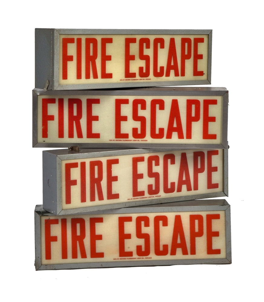 one of four matching c. 1940's vintage american industrial salvaged chicago factory illuminated "fire escape" wall or ceiling-mount sign with original enameled glass and steel housing