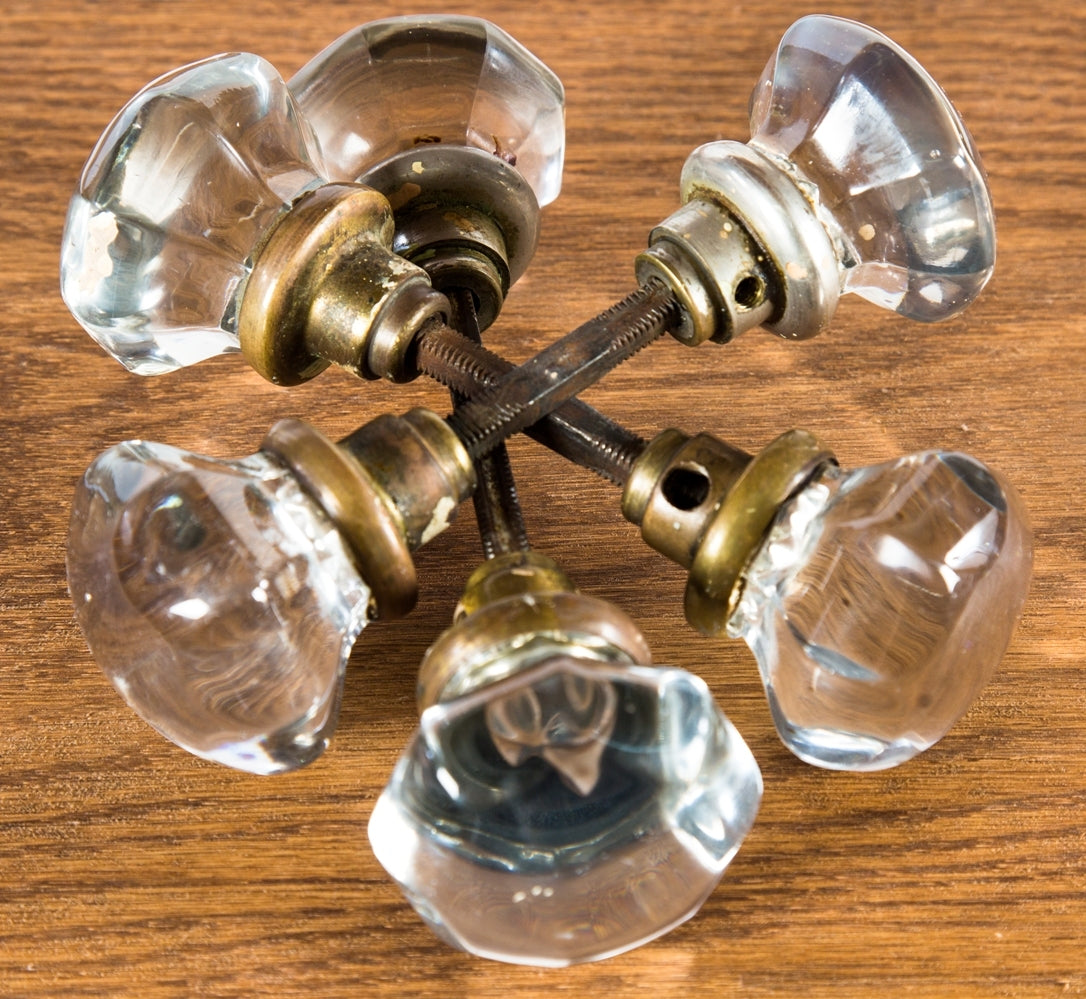 group of six matching early 20th century antique american oversized or "jumbo" size pressed glass interior residential passage door handles with intact shanks and threaded spindles