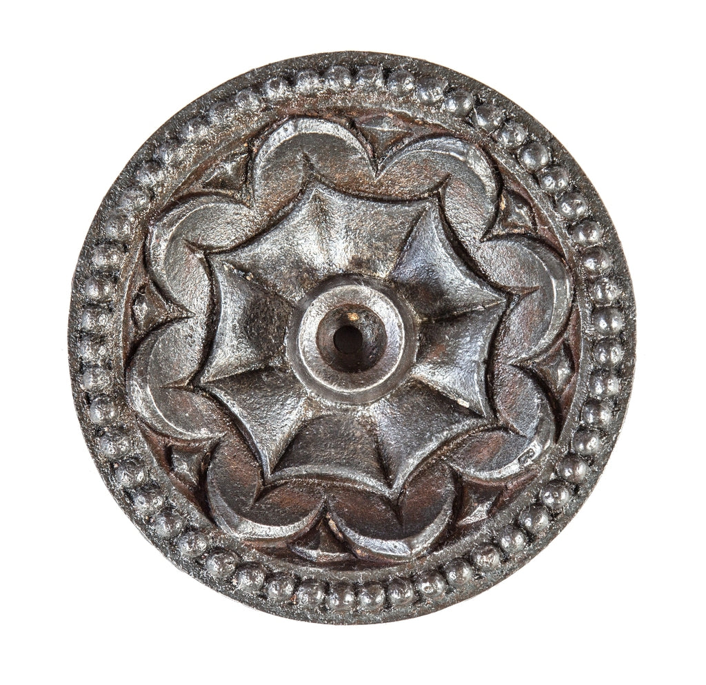 lightly cleaned and sealed original john edelmann-designed ornamental cast iron exterior commercial building tie rod rosette with distinctive centrally located spider web