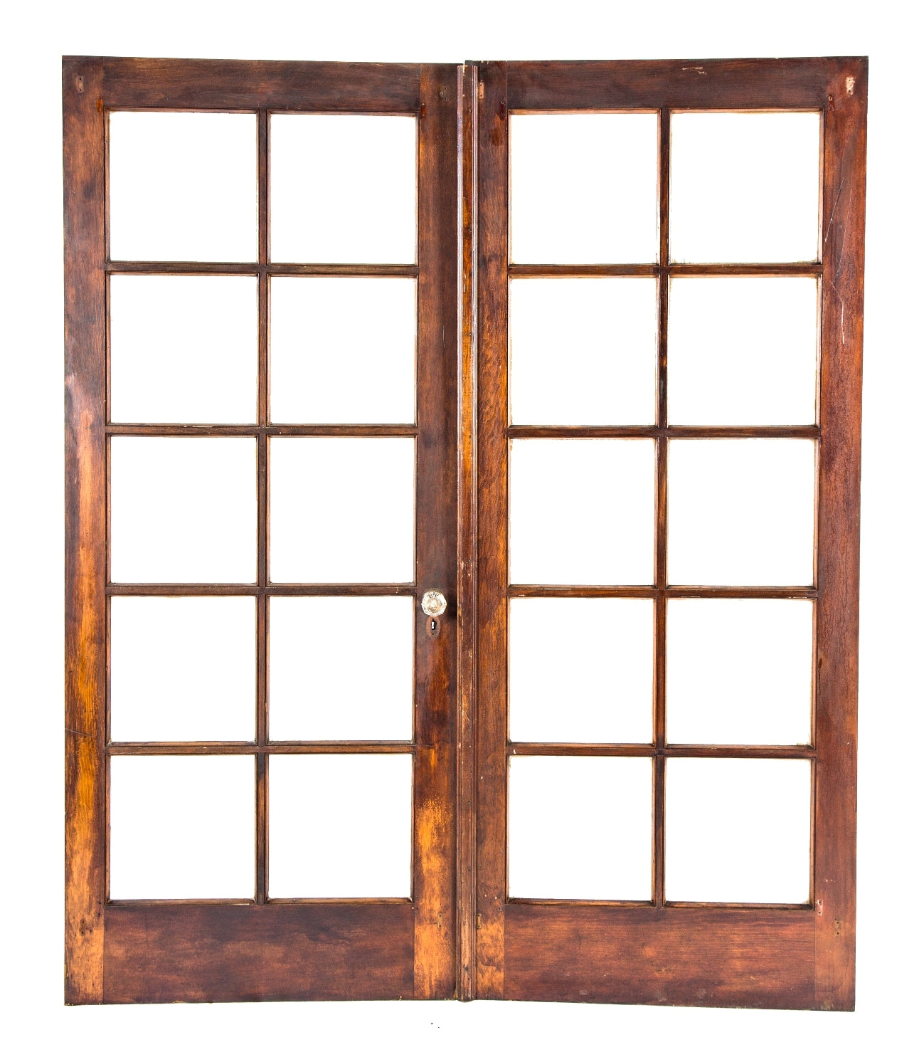 well-maintained set of original and intact early 20th century varnished birch wood hinged interior residential french doors with intact clear glass panels divided by wood muntins