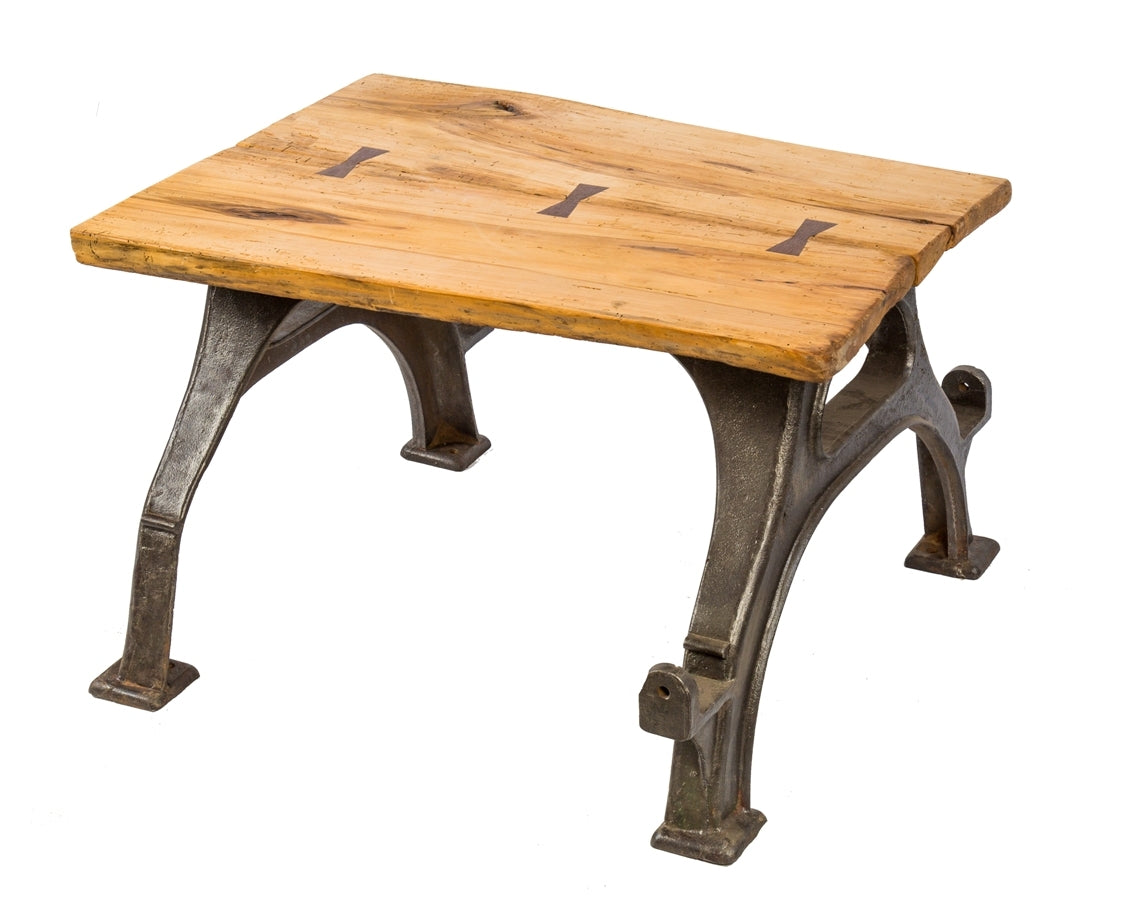 repurposed antique american industrial stationary heavy duty four-legged brushed cast iron coffee table with newly added slab of wood with walnut butterfly joints
